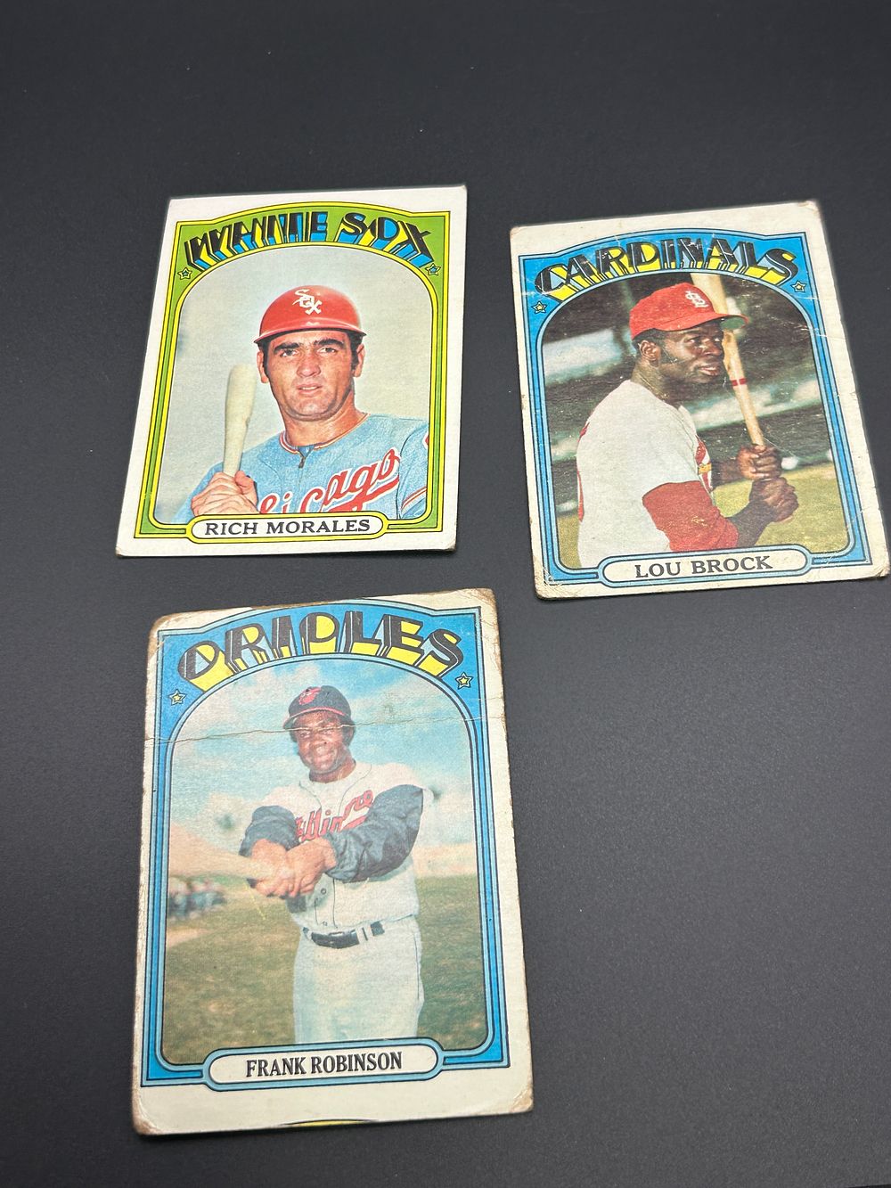 Lot 174: A Trio of 1972 Topps Baseball Cards Featuring Lou Brock and Frank Robinson