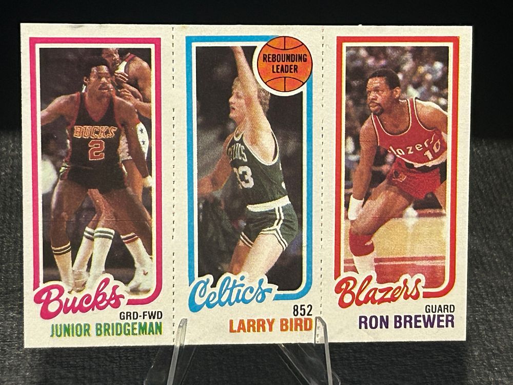 Lot 256: 1980-81 Topps Larry Bird Rookie Card Panel 31 Junior Bridgeman 146 Ron Brewer 198