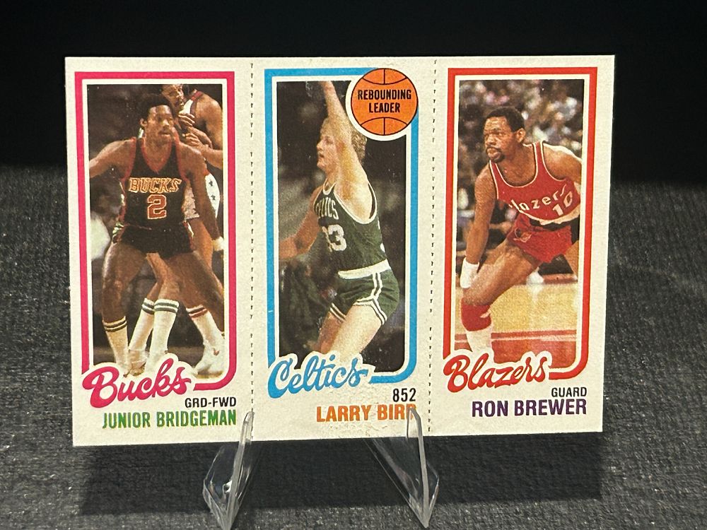 Lot 259: 1980-81 Topps Basketball Card Junior Bridgeman / Larry Bird / Ron Brewer #146 / 31 / 198