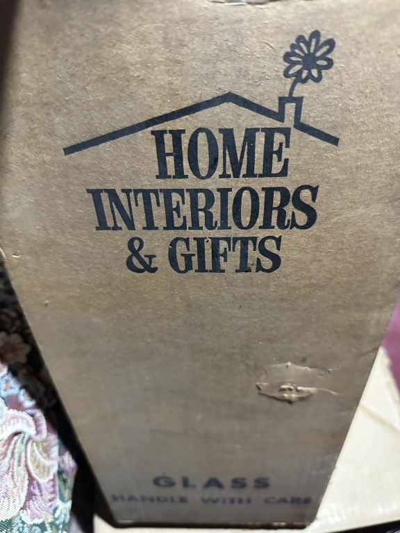 Box Lot Of Glass Plates & Silverplate estate box lot with glass cake plates, trays, candlestick, and assorted serving pieces.