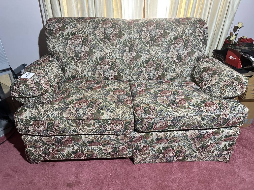 Floral Upholstered Loveseat 2-cushion floral upholstered loveseat. Measures approx. 63" long