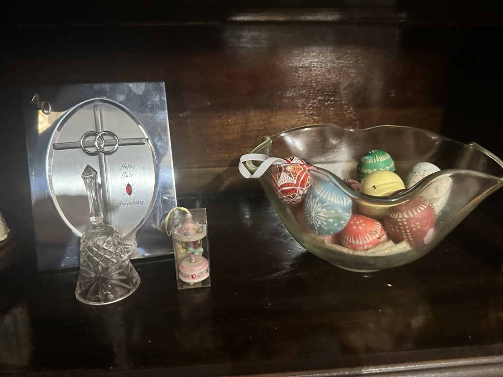 Hutch Contents With Glassware & Decor assorted glassware, stemware, teacups, holiday decor, ornaments, bells, and small decorative items fro
