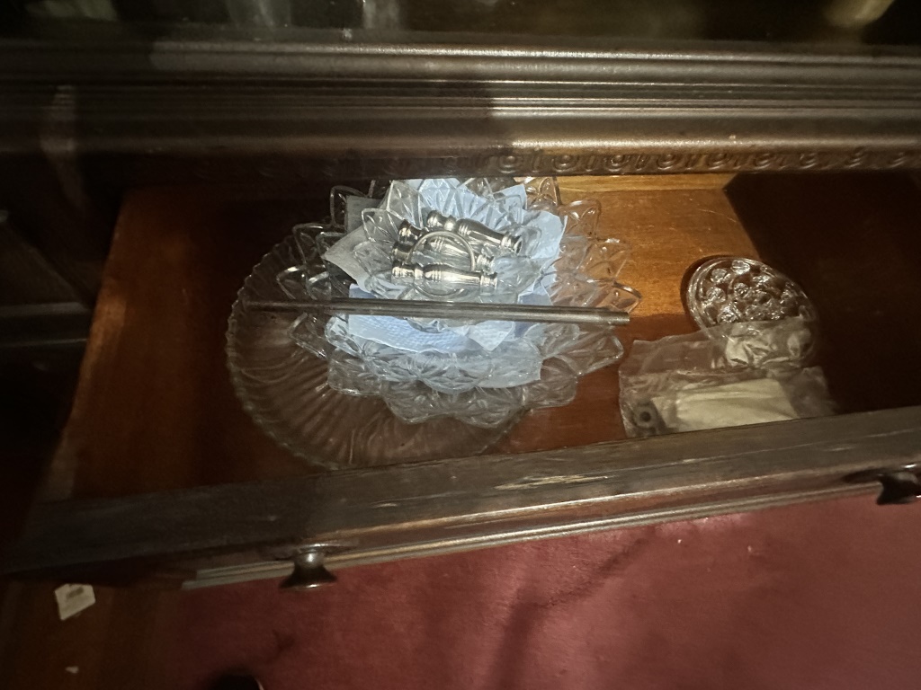 Hutch Contents With Glassware & Decor assorted glassware, stemware, teacups, holiday decor, ornaments, bells, and small decorative items fro