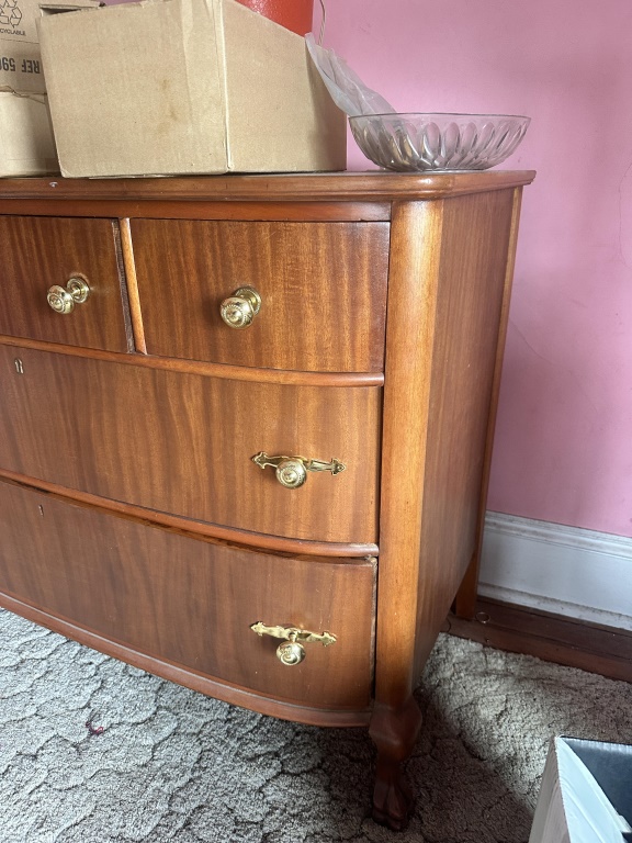 Wood Dresser wood dresser with 2 large drawers, 3 small upper drawers, brass-tone pulls, and curved front. Approx 45" Long