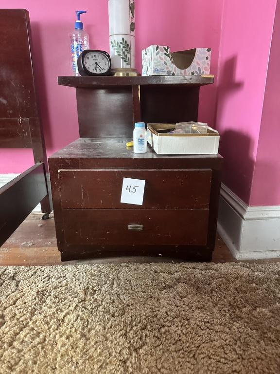 Pair Of Mid-Century Era Nightstands matching pair of wood nightstands with 2 drawers and open shelf area. Contents not included