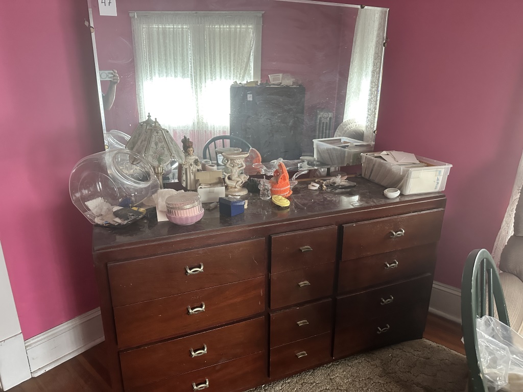 Long Dresser With Mirror long dresser with large mirror and multiple drawers. Measures approx. 62" wide. Contents not included