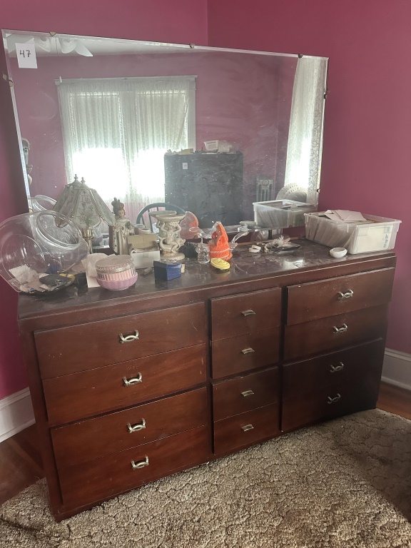 Long Dresser With Mirror long dresser with large mirror and multiple drawers. Measures approx. 62" wide. Contents not included