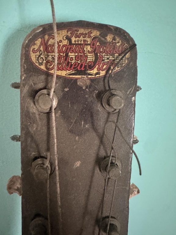 The First National Institute Of Allied Arts Guitar vintage acoustic guitar marked The First National Institute of Allied Arts. Project/displ