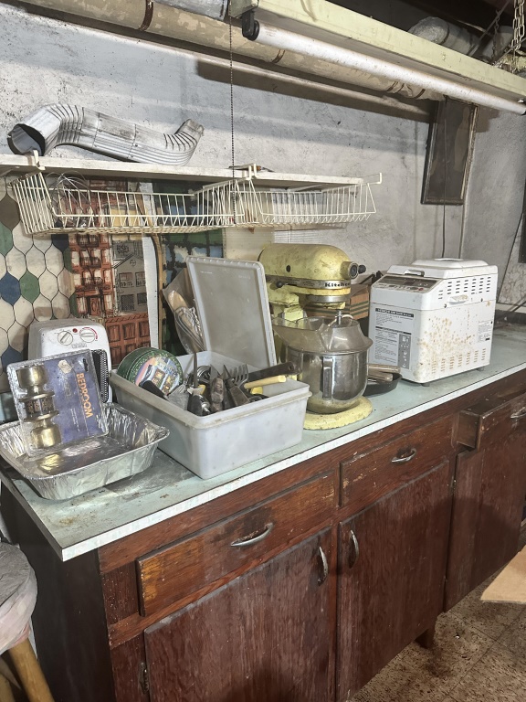 Pickers Rights of Entire Basement includes vintage KitchenAid stand mixer, large quantity of glass canning jars, wooden multi-drawer parts/s
