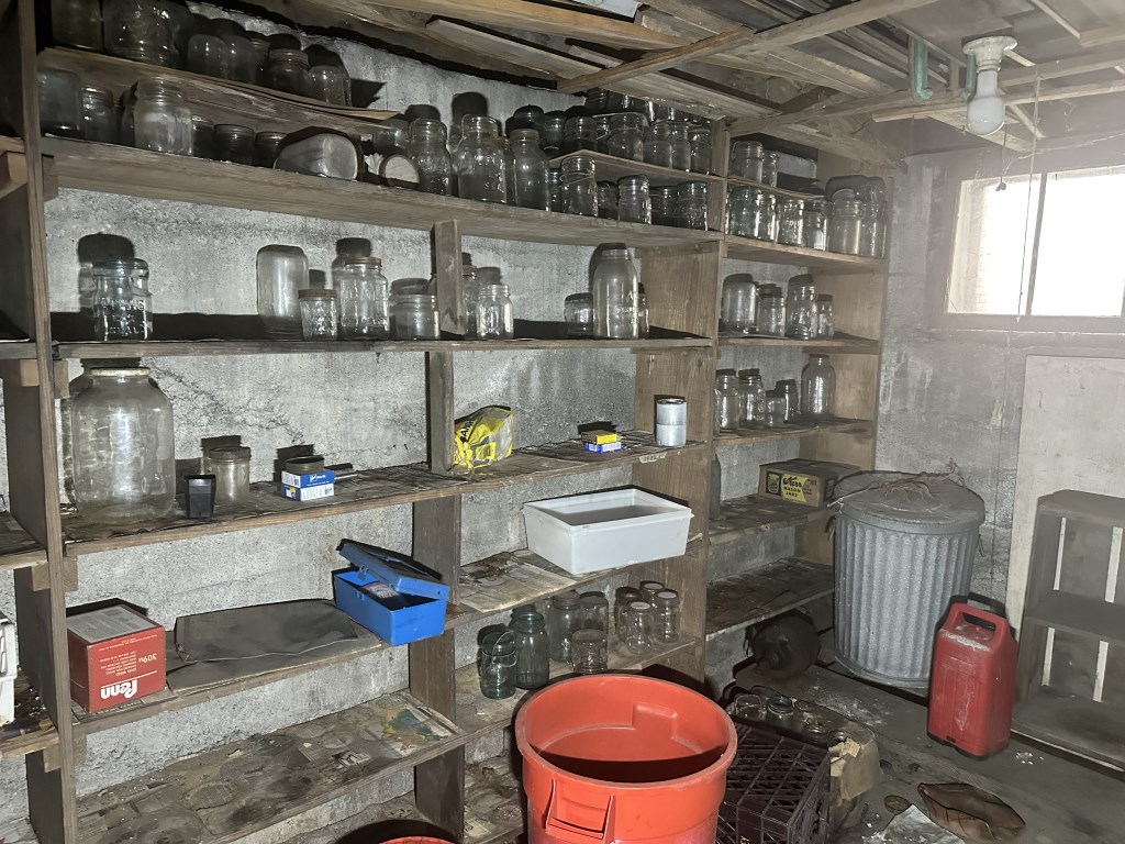 Pickers Rights of Entire Basement includes vintage KitchenAid stand mixer, large quantity of glass canning jars, wooden multi-drawer parts/s