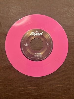 The Beatles “Yesterday” Pink 45 RPM Record. Capitol S7-18901-A jukebox-only record on bright 