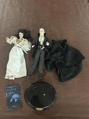 The Phantom of the Opera Porcelain Dolls. Pair of costumed porcelain character dolls depicting 