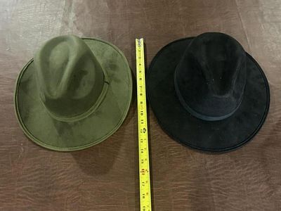 Pair of Western Style Wide Brim Hats. Black and olive green western-style hats with wide brims 