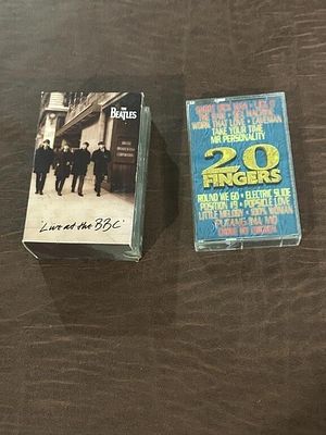 The Beatles Cassette Tape Pair. Includes “Live at the BBC” double cassette set and “20 Fingers” 