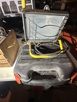 Black & Decker Drill and Work Light. Black & Decker cordless power drill set inside a black 