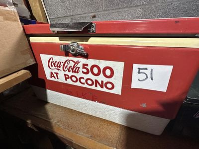 1970s Coleman Pocono Cooler. Red metal Coleman steel-belted cooler with built-in bottle opener 