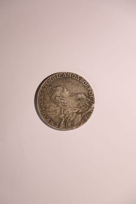 A Russian rouble dated 1761, featuring a portrait of Catherine I of Russia. 
Sold as a replica.