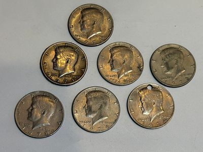 A collection of 7 Kennedy half dollar coins, United States.