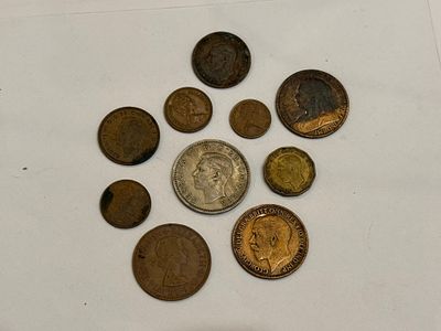 A collection of 10 coins from the United Kingdom.