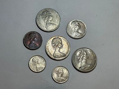 A collection of seven coins featuring the portrait of Queen Elizabeth II.