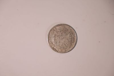 A 5 French francs coin, dated 1875, marked (COPY) – sold as a replica.