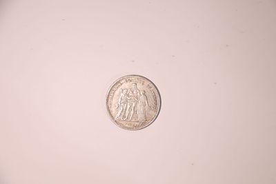 A 5 French francs coin, dated 1875, marked (COPY) – sold as a replica.