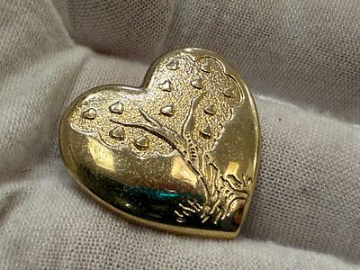Vintage heart-shaped brooch featuring the inscription The Variety Club.