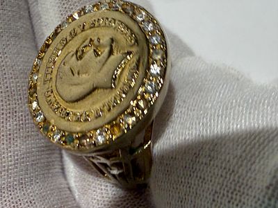 Impressive vintage gold-plated ring with a bold, substantial design. Set with a surround of 
