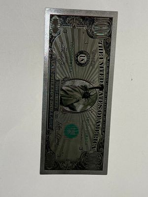 שטר פנטזיה בעיצוב “מיליון דולר” בסגנון אמריקאי. 
בחזית מופיע איור של פסל החירות עם מספר סידורי 