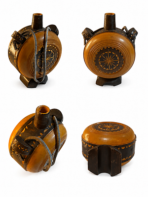 1BS. A heritage water canteen crafted from natural wood, hand-carved in a flat, circular design 