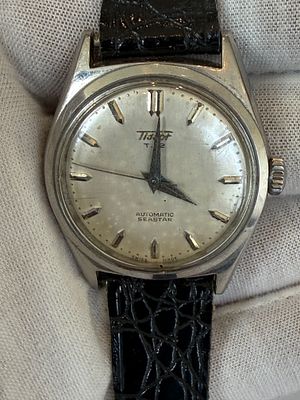 שעון יד שוויצרי מקורי מתוצרת Tissot, דגם Seastar T.12 Automatic, תוצרת שווייץ. 
לוח בגוון כסף עם 