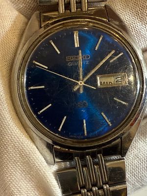 A Seiko SQ Quartz wristwatch. 
The watch is currently running, not fully tested, and sold As Is.