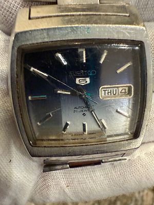 A Seiko 6119-5520 wristwatch. 
The watch is currently running, not fully tested, and sold As Is.
