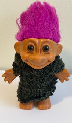 Vintage Troll doll – pink/magenta-haired Troll in a green knitted sweater. This is a classic 
