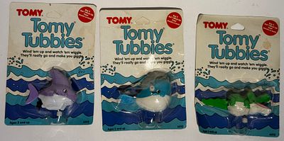 Three vintage TOMY "Tomy Tubbies" wind-up water/bath toys on their original blister cards (item 
