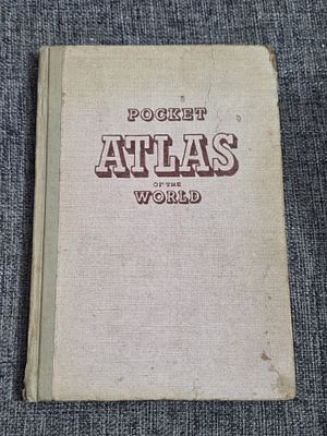 Vintage hardcover "Pocket Atlas of the World" with cloth-covered boards and decorative brown 
