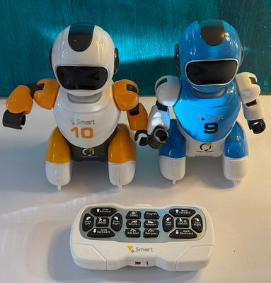 Pair of "Smart Robot Power" remote-controlled soccer/football playing robot toys with their 