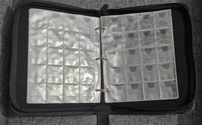 Coin collector's album/binder with a grey faux-leather zip-around cover, wrist strap, and 