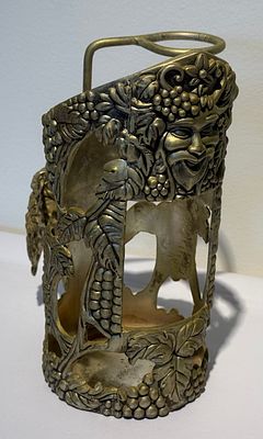 Vintage wine bottle holder by Godinger, New York (1982) — cast metal with antique brass 