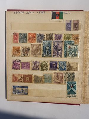 stamp album containing a global collection of several hundred stamps, most of them canceled 