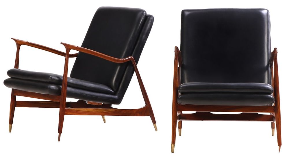 PAIR BRAZILIAN ROSEWOOD AND LEATHER UPHOLSTERED OPEN ARM CHAIRS. ALL BRASS CAPS PRESENT. Pair 