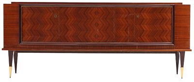 FRENCH ART DECO STYLE FOUR DOOR SIDEBOARD HAVING EXOTIC WOOD GRAIN AND A SYCAMORE INTERIOR C 1950. 