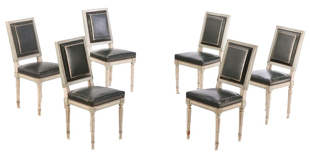 SIX FRENCH PAINTED LOUIS XVI STYLE DINING CHAIRS HAVING ORIGINAL LEATHER UPHOLSTERY C 1945. ENSUITE