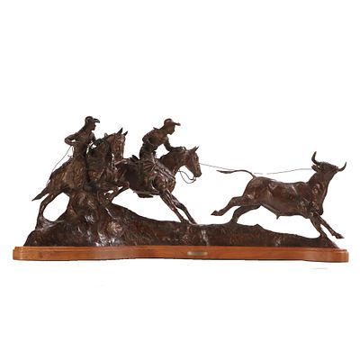 JC DYE (AMERICAN B. 1948) SAGE CREEK COWBOY A LARGE BRONZE SCULPTURE DEPICTING COWBOYS LASSOING. 