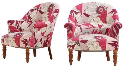 A PAIR OF NAPOLEON III LOUNGE CHAIRS HAVING CONTINUOUS BACK AND WILD FLORAL UPHOLSTERY. A pair 