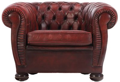 A STYLIZED RED LEATHER CHESTERFIELD CLUB CHAIR WITH BUTTON BACK UPHOLSTERY CIRCA 1950. A 