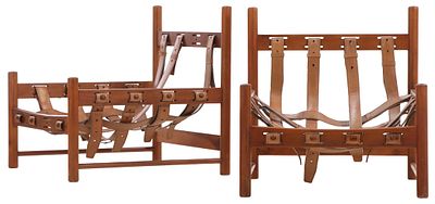 PAIR OF WOOD ARM CHAIRS IN THE MANNER OF SERGIO RODRIGUEZ HAVING LEATHER STRAP SUPPORTS C 1960. 