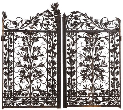 ORNATE PAIR OF HAND WROUGHT IRON GATES HAVING FLOWERS AND LEAVES C 1940. Ornate pair of hand 