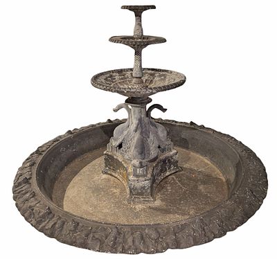 A NEOCLASSICAL STYLE ZINC FOUNTAIN HAVING SWANS AND LILY PADS C 1920. A Neoclassical style zinc 