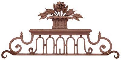 ENGLISH REGENCY STYLE WROUGHT IRON PEDIMENT SUPPORTING A BASKET OF FLOWERS C 1900. English 